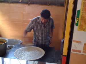 Dosa maker at Pai Brothers, in Kochi, just off MG road.